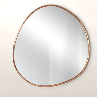 Rozā zelta oļu sienas spogulis
